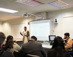 Awais Hussain giving a presentation on genealogy at the JAAG Panjabi and Pahari-Pothwari Language and Literature Festival in Birmingham, UK.