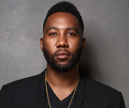 A professional portrait of Ndaba Mandela, South African author, speaker, and grandson of Nelson Mandela, who will deliver a virtual keynote at RootsTech 2025.