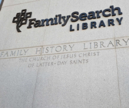 The exterior of the FamilySearch Library in Salt Lake City, showcasing the engraved sign for the Family History Library and The Church of Jesus Christ of Latter-day Saints.
