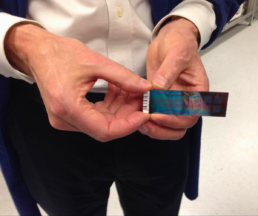Person holding a 2013 Family Finder DNA microarray chip, which included few Y-DNA SNPs and did not provide haplogroup results for male testers at the time