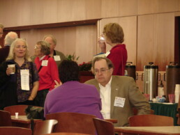 Jim Bartlett speaks with Roberta Estes during the National Geographic Genographic Project Conference in the mid-2000s.